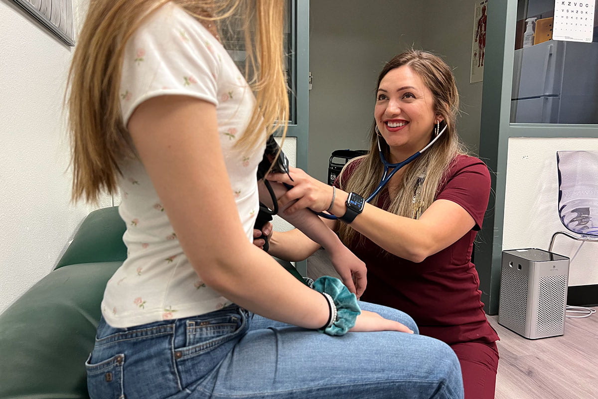 Hopewell Middle School nurse checking a student's blood pressure