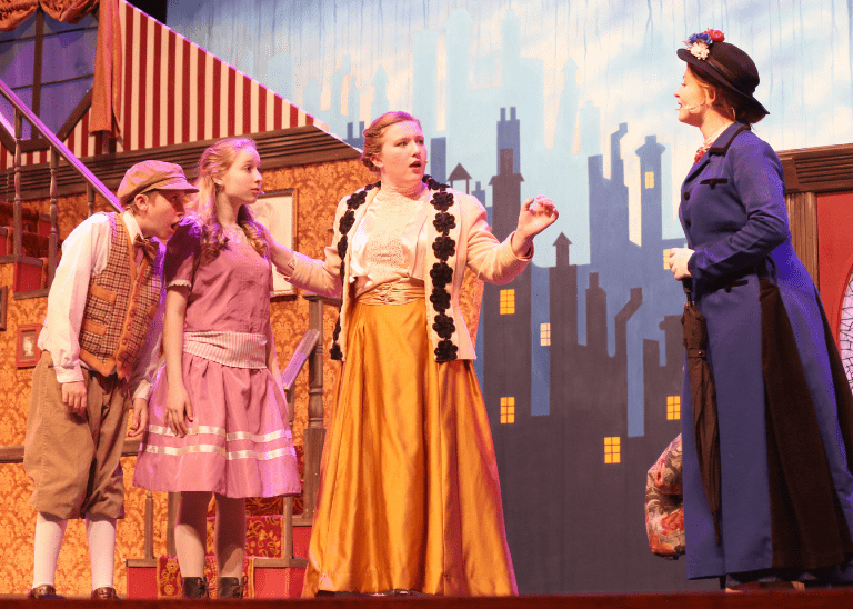 theatre production of Mary Poppins. cast members in costumes